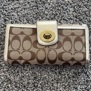 Brown and Silver Wallet with Logo Pattern